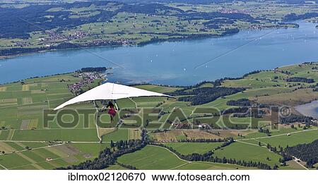 Hang gliding from Tegelberg Mountain, overlooking Froggensee lake, Upper Bavaria, Bavaria, Germany, Europe, PublicGround, Europe View Large Photo Image Stock Image - Hang gliding from Tegelberg Mountain, overlooking Froggensee lake, Upper Bavaria, Bavaria, Germany, Europe, PublicGround, Europe. Fotosearch