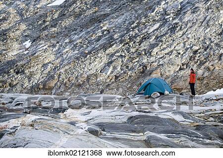 Hiker and tent on rock formations, at the Mittivakkat Glacier, Ammassalik Peninsula, East Greenland View Large Photo Image Stock Photo - Hiker and tent on rock formations, at the Mittivakkat Glacier, Ammassalik Peninsula, East Greenland. Fotosearch