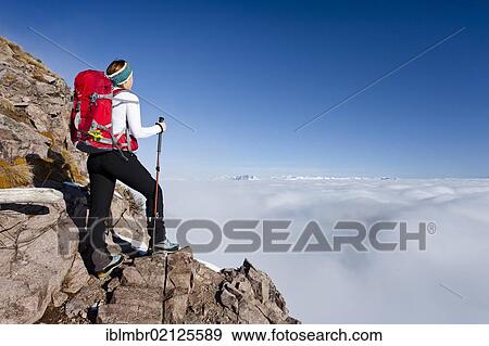 Hiker ascending Grossen Laugenspitze Mountain above Laugenalm alpine pastures, looking towards the Dolomites, Gampen Pass, Alto Adige, Italy, Europe View Large Photo Image Stock Photo - Hiker ascending Grossen Laugenspitze Mountain above Laugenalm alpine pastures, looking towards the Dolomites, Gampen Pass, Alto Adige, Italy, Europe. Fotosearch