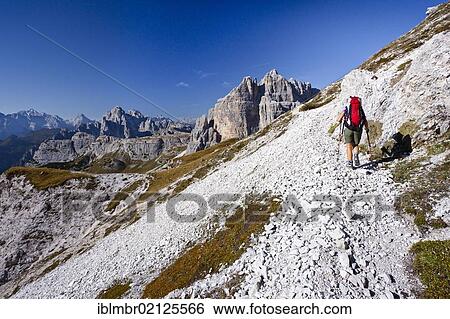 Hiker ascending Paternkofel Mountain, currently below the Buellelejoch Pass, looking towards the Cadini Group, Alta Pusteria, Sesto, Dolomites, Alto Adige, Italy, Europe View Large Photo Image Stock Photograph - Hiker ascending Paternkofel Mountain, currently below the Buellelejoch Pass, looking towards the Cadini Group, Alta Pusteria, Sesto, Dolomites, Alto Adige, Italy, Europe. Fotosearch