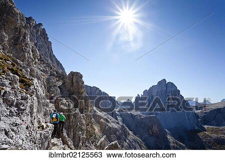 Hiker ascending the Alpinisteig climbing route, currently on Elferscharte Mountain, looking towards Zwoelferkofel Mountain, Alta Pusteria, Sesto, Dolomites, Alto Adige, Italy, Europe View Large Photo Image Stock Image - Hiker ascending the Alpinisteig climbing route, currently on Elferscharte Mountain, looking towards Zwoelferkofel Mountain, Alta Pusteria, Sesto, Dolomites, Alto Adige, Italy, Europe. Fotosearch