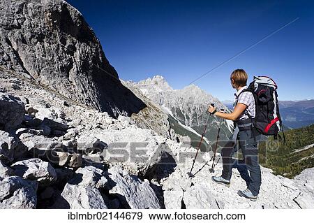 Hiker ascending the Alpinisteig climbing route through Fischleintal Valley above the Talschluss Hut, looking towards Dreischusterspitze Mountain, Sesto, Alta Pusteria, Dolomites, Alto Adige, Italy, Europe View Large Photo Image Stock Photo - Hiker ascending the Alpinisteig climbing route through Fischleintal Valley above the Talschluss Hut, looking towards Dreischusterspitze Mountain, Sesto, Alta Pusteria, Dolomites, Alto Adige, Italy, Europe. Fotosearch