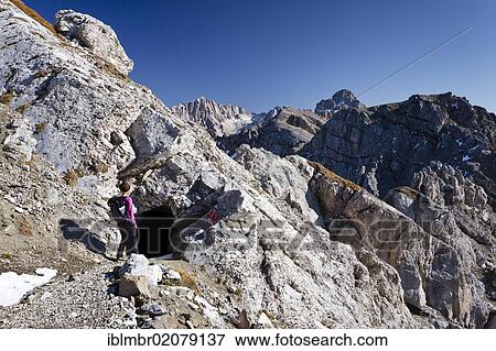 Hiker at the Bepi Zac via ferrata in the San Pellegrino valley, above the San Pellegrino pass, Mt Marmolada in the back, Dolomites, Trentino, Italy, Europe View Large Photo Image Stock Photo - Hiker at the Bepi Zac via ferrata in the San Pellegrino valley, above the San Pellegrino pass, Mt Marmolada in the back, Dolomites, Trentino, Italy, Europe. Fotosearch