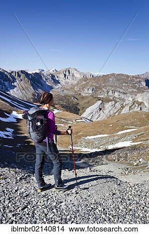 Picture - Hiker at the Bervagabunden-Huette hut, on the ascent to the Bepi Zac climbing trail in the San Pellegrino valley above the San Pellegrino Pass, behind the Dolomites, Trentino, Italy, Europe. Fotosearch