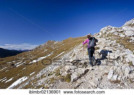 Hiker during the ascent to Bepi Zac climbing route in the San Pellegrino Valley above the San Pellegrino Pass, Dolomites, Trentino, Italy, Europe View Large Photo Image Stock Image - Hiker during the ascent to Bepi Zac climbing route in the San Pellegrino Valley above the San Pellegrino Pass, Dolomites, Trentino, Italy, Europe. Fotosearch