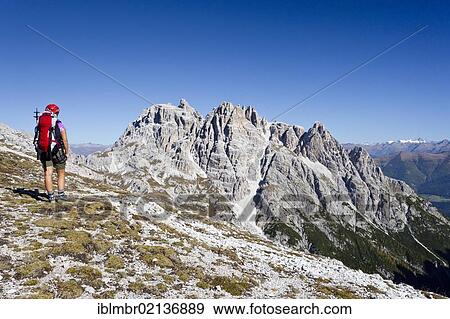 Hiker during the ascent to Paternkofel Mountain, looking towards Dreischusterspitze Mountain, above the Altensteintal Valley, Sesto, Alta Pusteria, Dolomites, Alto Adige, Italy, Europe View Large Photo Image Stock Photo - Hiker during the ascent to Paternkofel Mountain, looking towards Dreischusterspitze Mountain, above the Altensteintal Valley, Sesto, Alta Pusteria, Dolomites, Alto Adige, Italy, Europe. Fotosearch