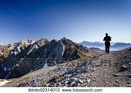 Hiker during the ascent to the Bepi-Zac fixed rope route in the San Pellegrino Valley above the San Pellegrino Pass, Costabela and Marmolada mountain at the back, province of Trentino, Dolomites, Italy, Europe View Large Photo Image Stock Image - Hiker during the ascent to the Bepi-Zac fixed rope route in the San Pellegrino Valley above the San Pellegrino Pass, Costabela and Marmolada mountain at the back, province of Trentino, Dolomites, Italy, Europe. Fotosearch