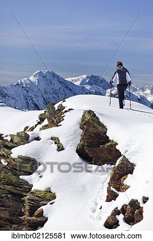 Stock Image - Hiker on Roethenspitz Mountain above Penser Joch Pass, Sarn Valley, Alto Adige, Italy, Europe. Fotosearch