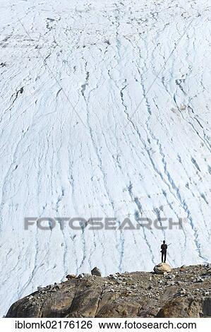 Hiker with a rifle, at Mittivakkat Glacier, Ammassalik Peninsula, East Greenland, Greenland, North America View Large Photo Image Stock Photograph - Hiker with a rifle, at Mittivakkat Glacier, Ammassalik Peninsula, East Greenland, Greenland, North America. Fotosearch