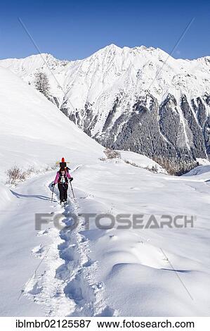 Hiker with snowshoes ascending to Jagelealm alpine pasture in Ridnauntal Valley above Entholz, looking towards Telfer Weissen Mountain, Alto Adige, Italy, Europe View Large Photo Image Stock Photo - Hiker with snowshoes ascending to Jagelealm alpine pasture in Ridnauntal Valley above Entholz, looking towards Telfer Weissen Mountain, Alto Adige, Italy, Europe. Fotosearch