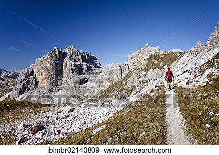 Hikers below the Buellelejoch pass, ascending the Paternkofel behind, Sexten, South Tyrol, Dolomites, South Tyrol, Italy, Europe View Large Photo Image Stock Photo - Hikers below the Buellelejoch pass, ascending the Paternkofel behind, Sexten, South Tyrol, Dolomites, South Tyrol, Italy, Europe. Fotosearch