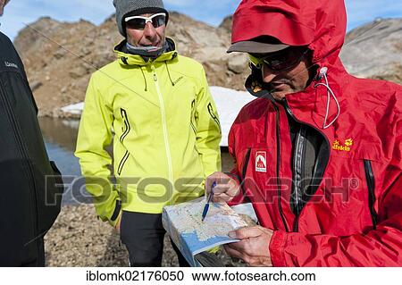 Hikers with a hiking map, Ammassalik Peninsula, East Greenland, Greenland, North America View Large Photo Image Stock Image - Hikers with a hiking map, Ammassalik Peninsula, East Greenland, Greenland, North America. Fotosearch