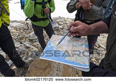 Hikers with a hiking map, Ammassalik Peninsula, East Greenland, Greenland, North America View Large Photo Image Stock Image - Hikers with a hiking map, Ammassalik Peninsula, East Greenland, Greenland, North America. Fotosearch