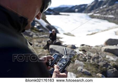 Hiking guide using a satellite phone, near Tasiilaq or Ammassalik, East Greenland, Greenland, North America View Large Photo Image Stock Image - Hiking guide using a satellite phone, near Tasiilaq or Ammassalik, East Greenland, Greenland, North America. Fotosearch