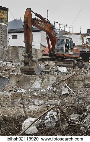 House demolition, excavator on building site, blocks of concrete and metal pieces at front, North Rhine-Westphalia, Germany, Europe, PublicGround, Europe View Large Photo Image Stock Image - House demolition, excavator on building site, blocks of concrete and metal pieces at front, North Rhine-Westphalia, Germany, Europe, PublicGround, Europe. Fotosearch