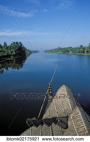 Stock Image - Houseboat on a wide canal in the backwaters, Kerala, South India, India, Asia. Fotosearch