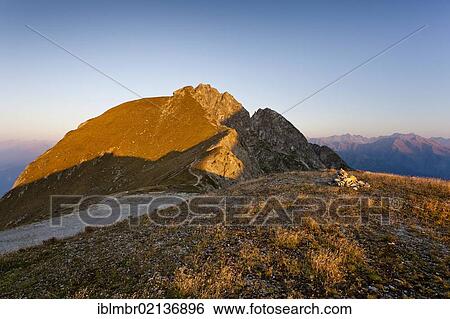 Stock Photograph - Ifinger Mountain, sunrise at the Kuhleiten Hut above Meran 2000, Merano, Alto Adige, Italy, Europe. Fotosearch