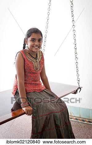 Indian girl sitting on a swing, Karaikudi, Chettinad, Tamil Nadu, South India, India, Asia View Large Photo Image Stock Image - Indian girl sitting on a swing, Karaikudi, Chettinad, Tamil Nadu, South India, India, Asia. Fotosearch