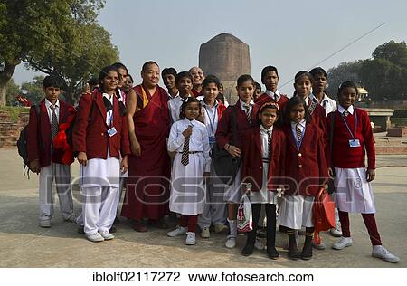 Indian girls from a school class in a group photo with Tibetan monks and rinpoche in front of the Dhamekh Stupa, game park of Isipatana, Sarnath, Uttar Pradesh, India, South Asia, Asia View Large Photo Image Stock Image - Indian girls from a school class in a group photo with Tibetan monks and rinpoche in front of the Dhamekh Stupa, game park of Isipatana, Sarnath, Uttar Pradesh, India, South Asia, Asia. Fotosearch