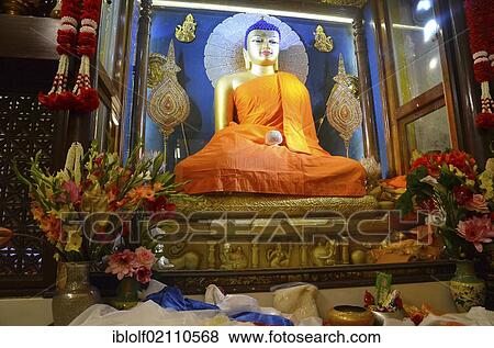 Interior view of the sacred Mahabodhi Temple, with the Buddha statue next to which Siddhartha Gautama, the historic Buddha, gained awakening, Bodhi, Bodhgaya, Bihar, India, Asia View Large Photo Image Stock Photo - Interior view of the sacred Mahabodhi Temple, with the Buddha statue next to which Siddhartha Gautama, the historic Buddha, gained awakening, Bodhi, Bodhgaya, Bihar, India, Asia. Fotosearch