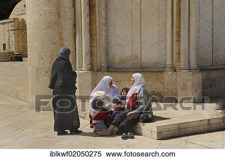 Stock Photography - Israeli Palestinian women wearing headscarves resting with their children on the base of the Ascension Church, Temple Mount, Muslim Quarter, Old City, Jerusalem, Israel, Middle East, Asia. Fotosearch