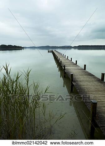 Stock Image - Jetty in Lake Woerthsee, Bavaria, Germany, Europe. Fotosearch