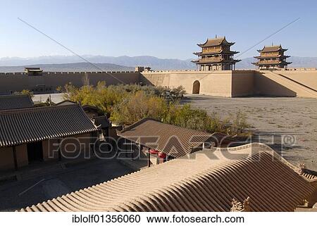 Jiayuguan fortress with two gatehouses at the western end of the Great Wall with trees in autumn colours, Silk Road, Gansu, China, Asia View Large Photo Image Stock Image - Jiayuguan fortress with two gatehouses at the western end of the Great Wall with trees in autumn colours, Silk Road, Gansu, China, Asia. Fotosearch