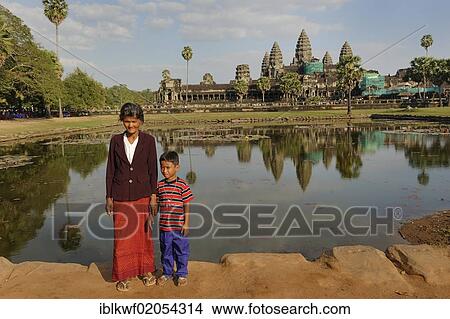Khmer woman and child in front of the Angkor Wat temple complex, Siam Reap, Cambodia, Southeast Asia, Asia View Large Photo Image Picture - Khmer woman and child in front of the Angkor Wat temple complex, Siam Reap, Cambodia, Southeast Asia, Asia. Fotosearch
