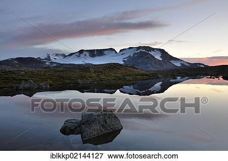 Stock Photo - Lake Fantesteinsvatnet looking towards Fannaraki Mountain, Jotunheimen National Park, Norway, Europe. Fotosearch