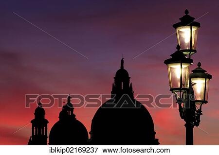Stock Photo - Lamp post in front of Santa Maria della Salute at sunset, Venice, Italy, Europe. Fotosearch