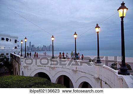 Lanterns along the promenade, Paseo Esteban Huertas, in front of the skyline of Panama City at dusk, Panama, Central America, North America View Large Photo Image Stock Image - Lanterns along the promenade, Paseo Esteban Huertas, in front of the skyline of Panama City at dusk, Panama, Central America, North America. Fotosearch