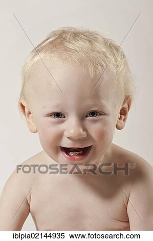 Stock Photography - Laughing toddler, boy, 1, portrait. Fotosearch