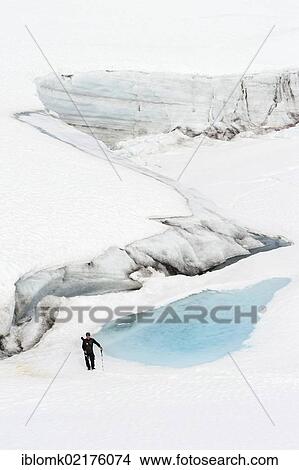Leader of a group of hikers with a rifle, at Mittivakkat Glacier, Ammassalik Peninsula, East Greenland, Greenland, North America View Large Photo Image Picture - Leader of a group of hikers with a rifle, at Mittivakkat Glacier, Ammassalik Peninsula, East Greenland, Greenland, North America. Fotosearch