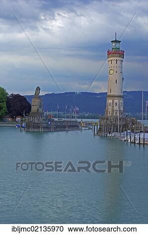 Stock Image - Lighthouse and Bavarian Lion at the harbor entrance, Lindau, Bodensee, Lake constance, Bavaria, Germany, Europe. Fotosearch