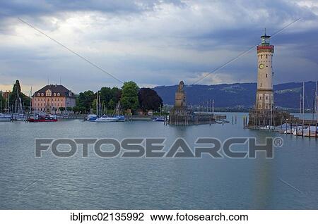 Stock Image - Lighthouse and Bavarian Lion at the harbor entrance, Lindau, Bodensee, Lake constance, Bavaria, Germany, Europe. Fotosearch