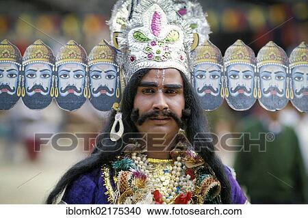 Stock Image - Man dressed as a demon, Ravana, king of the Rakshasas from the Ramayana epic, New Delhi, India, Asia. Fotosearch
