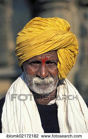 Man with a yellow turban and a red bindi, Belur, Karnataka, South India, India, Asia View Large Photo Image Stock Image - Man with a yellow turban and a red bindi, Belur, Karnataka, South India, India, Asia. Fotosearch