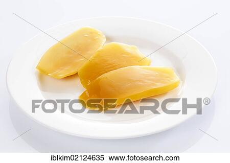 Mango pieces from a can on white plate View Large Photo Image Stock Photography - Mango pieces from a can on white plate. Fotosearch