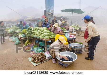 Stock Photo - Market shrouded in morning fog, Samyek, Moung Phou Khoun, Luang Prabang province, Laos, Indochina, Asia. Fotosearch