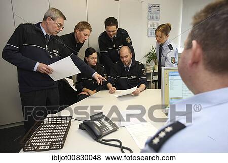 Meeting in the police HQ or headquarters at the shift start, Mettmann, North Rhine-Westphalia, Germany, Europe View Large Photo Image Stock Photo - Meeting in the police HQ or headquarters at the shift start, Mettmann, North Rhine-Westphalia, Germany, Europe. Fotosearch