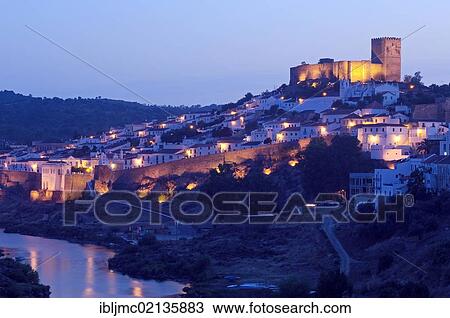 Stock Image - Mertola Castle and Guadiana river at dusk, Alentejo, Portugal, Europe. Fotosearch