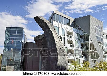 Stock Image - Modern facades of the Museum Residences, residential buildings in the Civic Center Cultural Complex, with a granite sculpture at the front, Denver, Colorado, USA, PublicGround, North America. Fotosearch