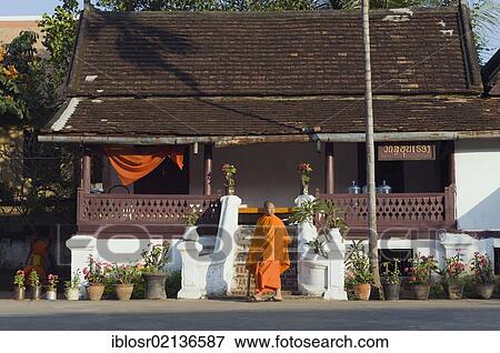 Monk at the temple, Wat Sibounheuang, Luang Prabang, UNESCO World Heritage Site, Laos, Indochina, Asia View Large Photo Image Stock Photo - Monk at the temple, Wat Sibounheuang, Luang Prabang, UNESCO World Heritage Site, Laos, Indochina, Asia. Fotosearch