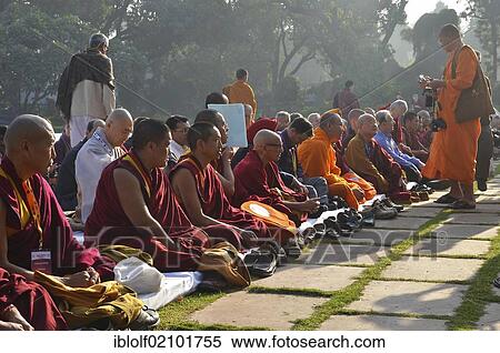 Monks from all Buddhist traditions gather for a communal prayer in their orange and red robes, Global Buddhist Congregation 2011, at Gandhi Smitri, New Delhi, India, Asia View Large Photo Image Stock Photography - Monks from all Buddhist traditions gather for a communal prayer in their orange and red robes, Global Buddhist Congregation 2011, at Gandhi Smitri, New Delhi, India, Asia. Fotosearch
