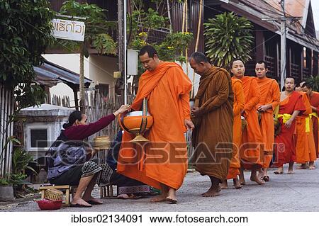 Monks on their morning alms round, Luang Prabang, Laos, Indochina, Asia View Large Photo Image Stock Image - Monks on their morning alms round, Luang Prabang, Laos, Indochina, Asia. Fotosearch