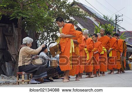 Monks on their morning alms round, Luang Prabang, Laos, Indochina, Asia View Large Photo Image Stock Photo - Monks on their morning alms round, Luang Prabang, Laos, Indochina, Asia. Fotosearch