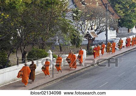 Monks on their morning alms round, Luang Prabang, Laos, Indochina, Asia View Large Photo Image Stock Photo - Monks on their morning alms round, Luang Prabang, Laos, Indochina, Asia. Fotosearch