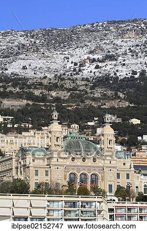 Monte Carlo Casino in winter with snow-covered mountains, Principality of Monaco, Côte d'Azur, Mediterranean Sea, Europe View Large Photo Image Stock Photo - Monte Carlo Casino in winter with snow-covered mountains, Principality of Monaco, Côte d'Azur, Mediterranean Sea, Europe. Fotosearch