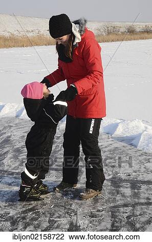 Mother teaching her little daughter how to skate on the ice, Hedeskoga, Skåne, Skane, Sweden, Europe View Large Photo Image Stock Image - Mother teaching her little daughter how to skate on the ice, Hedeskoga, Skåne, Skane, Sweden, Europe. Fotosearch