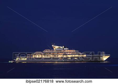 Stock Photo - Motor yacht "Rising Sun", 138m, at night, built by Luersson Yachts in 2004, owned by David Geffen, previously owned by Larry Ellison, Côte d'Azur, France, Mediterranean, Europe. Fotosearch